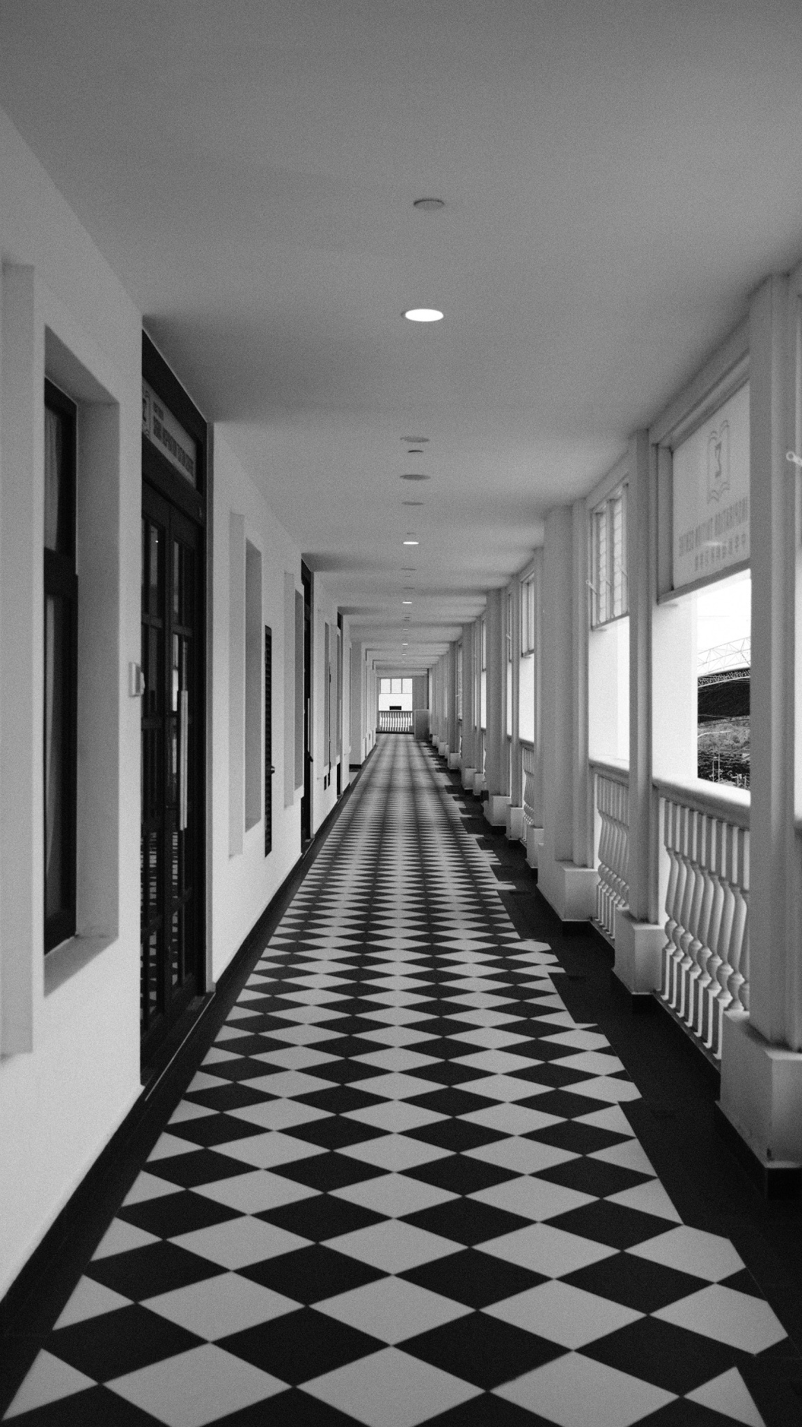 Black and white corridor with repeating checkerboard floor